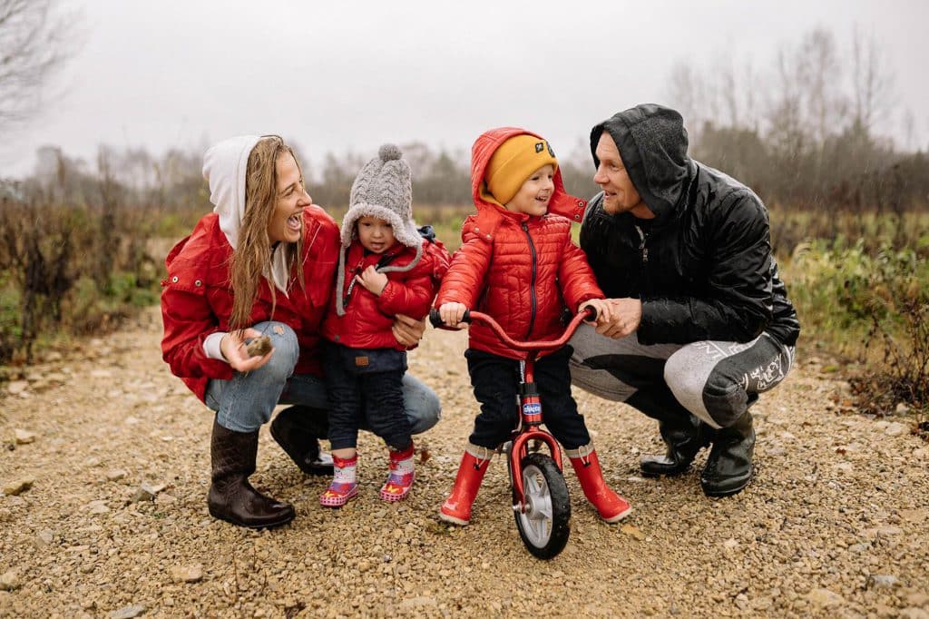 Man, woman and two children outdoors with wellies on near Meridian Homes alpartments for rent in indianapolis. Pexels yan krukov 5792910